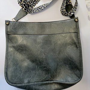 Gunmetal gray faux leather handbag with animal print fabric strap‎